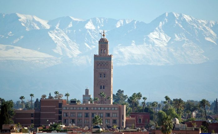 Marrakech to Merzouga desert tour group on the high plateau near Midelt