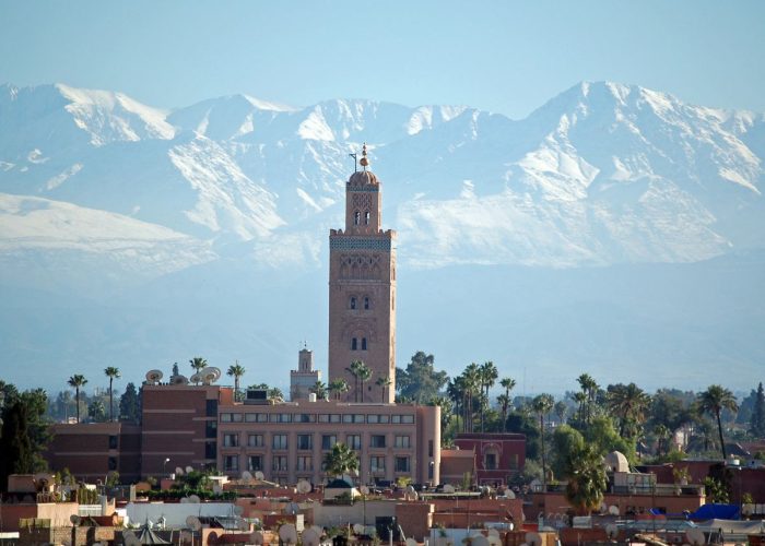 Marrakech to Merzouga desert tour group on the high plateau near Midelt