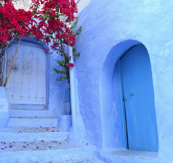 Travelers on a private Morocco desert tour crossing the golden Sahara dunes