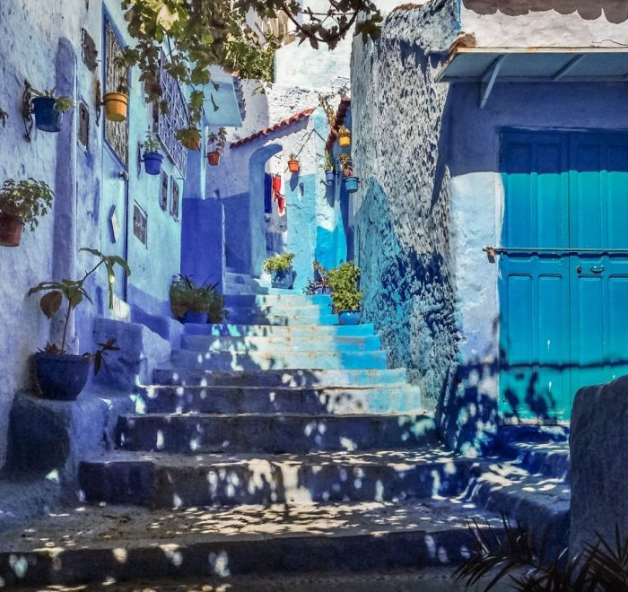 Merzouga desert experience 2026 group photo at the top of the highest dune